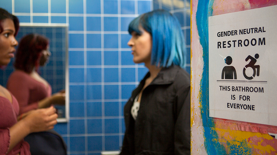 Two students in a gender-inclusive restroom