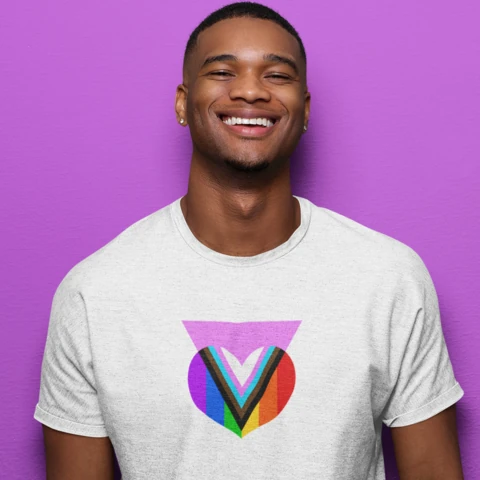 Man wearing t-shirt including photo of rainbow heart with a pink triangle