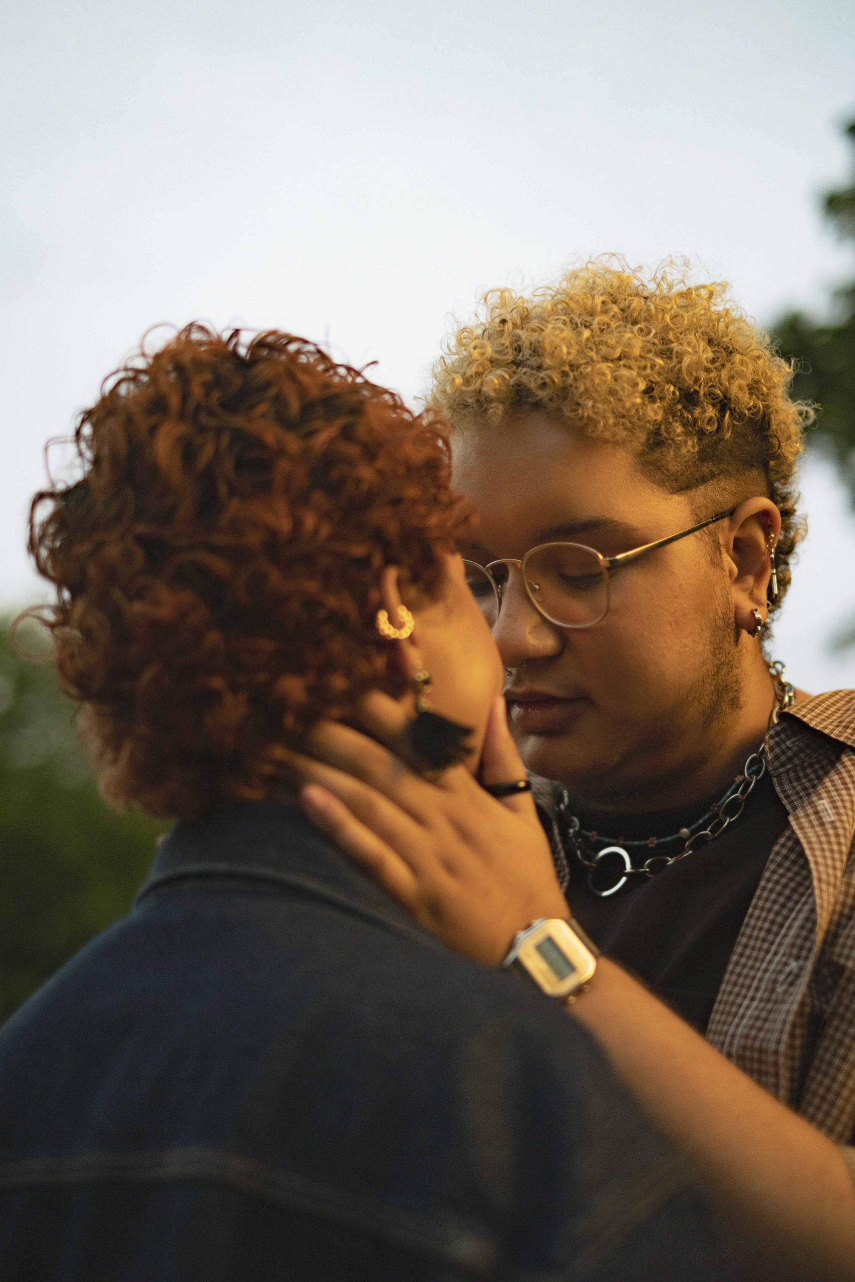 Photo of two short haired queer people about to kiss, from the Gender Spectrum Collection 